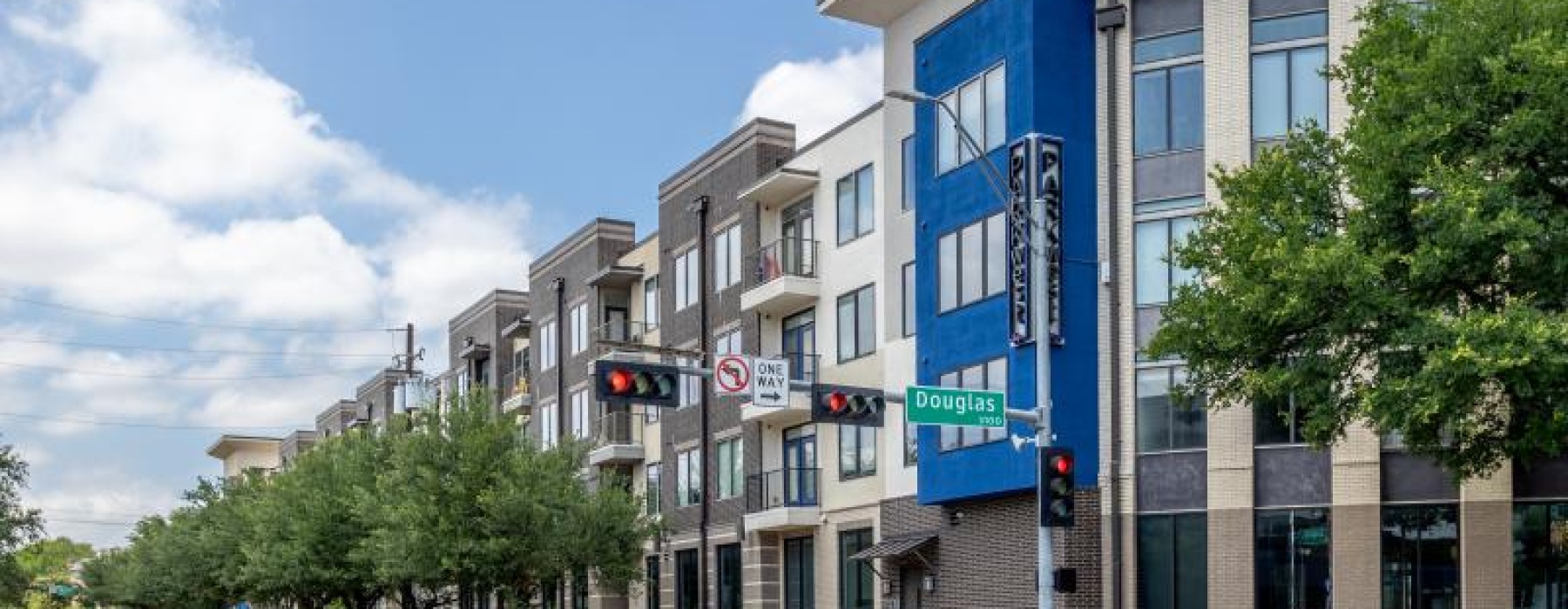 a street with a car and buildings